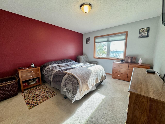 carpeted bedroom with a textured ceiling