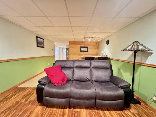 living room featuring wood-type flooring and rail lighting