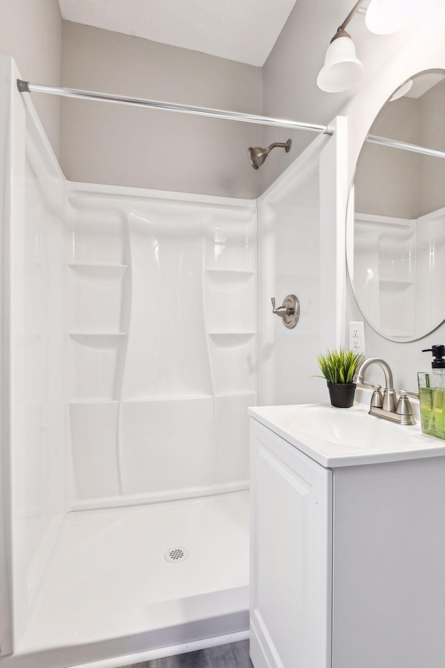 bathroom featuring vanity and walk in shower