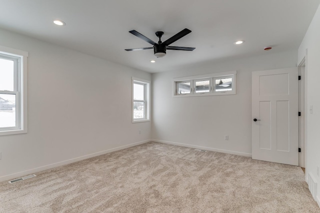 carpeted spare room with baseboards, ceiling fan, visible vents, and recessed lighting