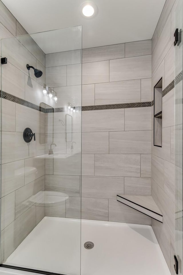 bathroom featuring a shower stall