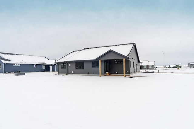 view of snow covered house