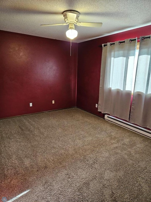 spare room with ceiling fan, carpet floors, a baseboard radiator, and a textured ceiling