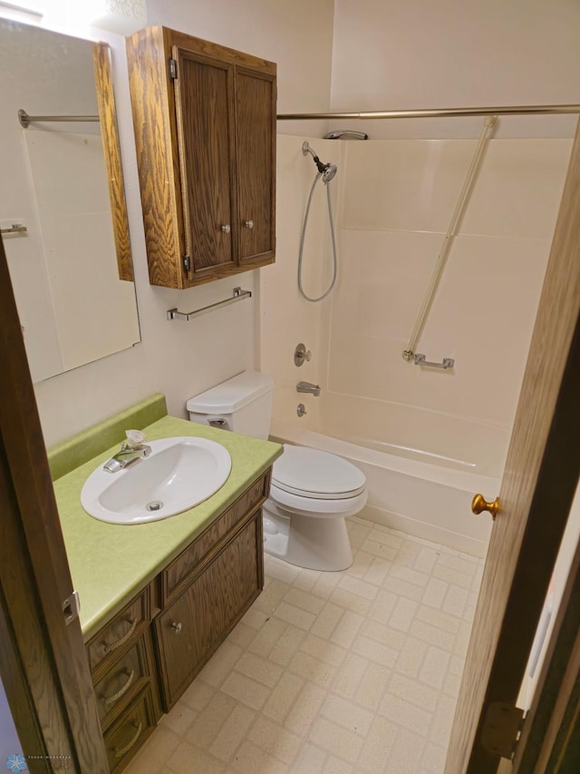 bathroom with shower / washtub combination, toilet, and vanity