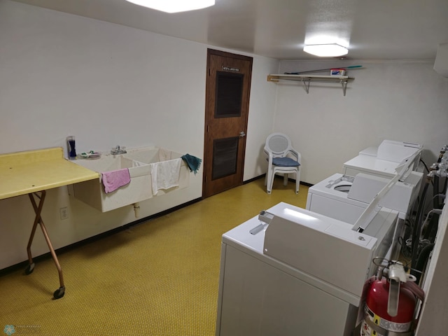 shared laundry area featuring washer and clothes dryer