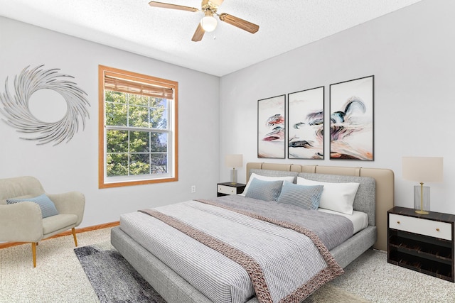 bedroom featuring a textured ceiling and ceiling fan