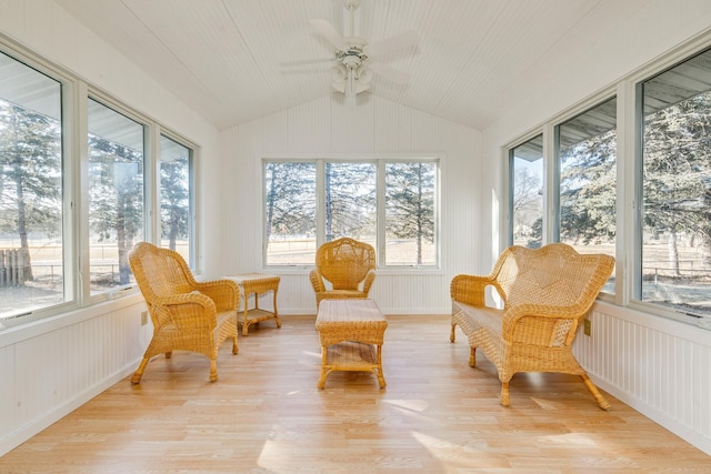 sunroom featuring lofted ceiling and ceiling fan