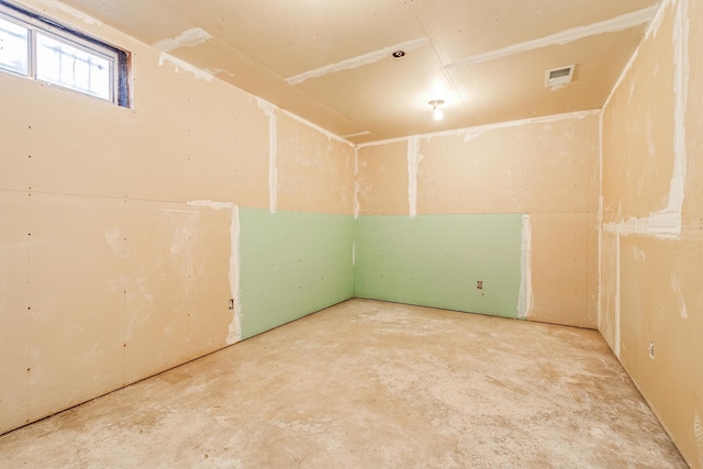 unfurnished room featuring concrete flooring