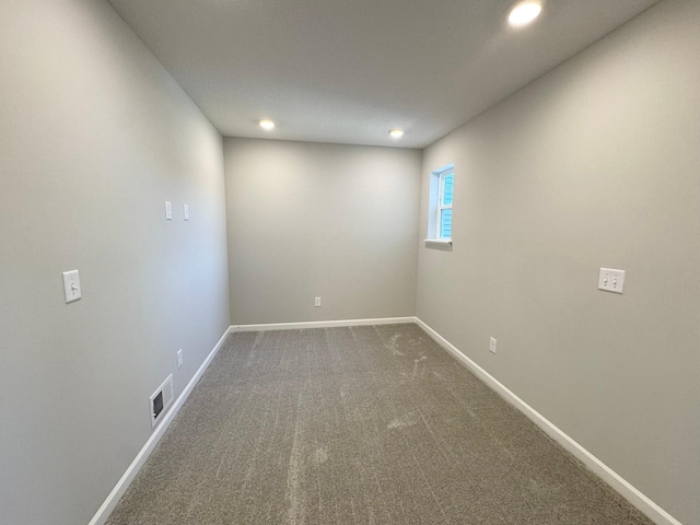 unfurnished room featuring carpet