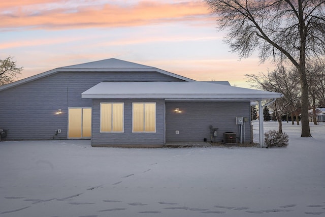 back house at dusk with central AC