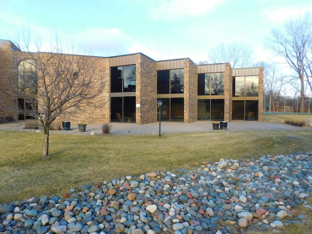 rear view of house with a lawn