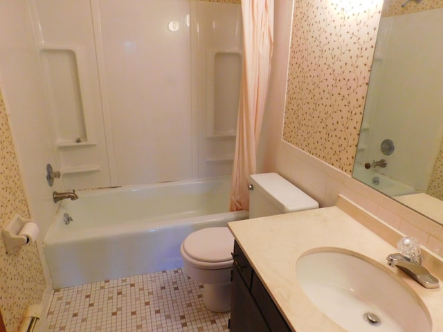 full bathroom featuring tile patterned floors, vanity, toilet, and shower / bath combo with shower curtain