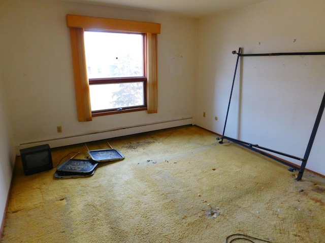 unfurnished room featuring a baseboard radiator