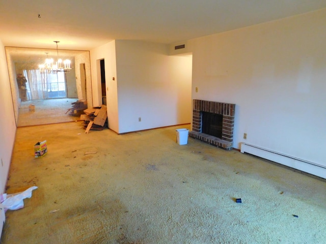 unfurnished living room featuring a fireplace, carpet, a baseboard radiator, and an inviting chandelier