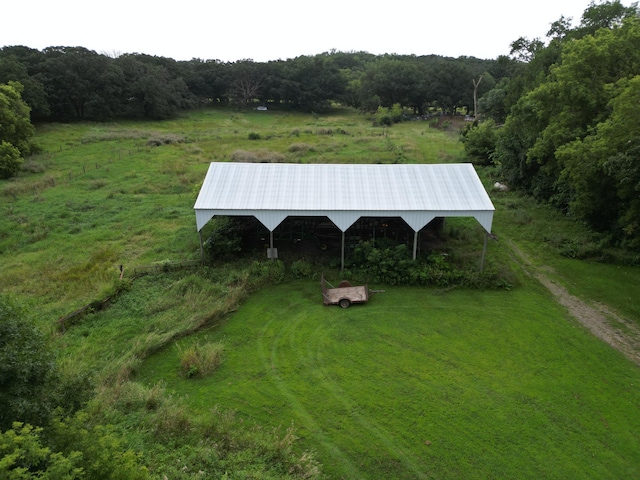 view of home's community featuring an outbuilding and a rural view