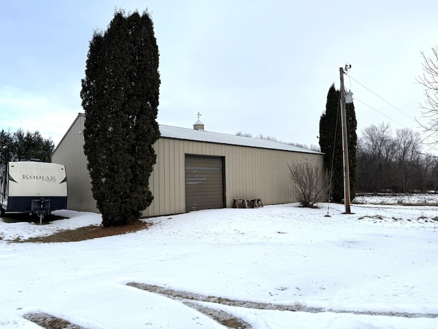 view of snow covered garage