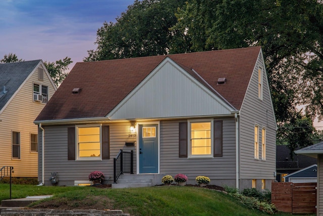 view of front of property with a yard