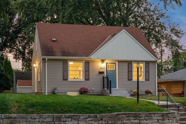 view of front of home with a lawn