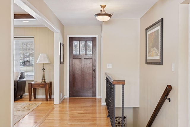 foyer with light hardwood / wood-style floors