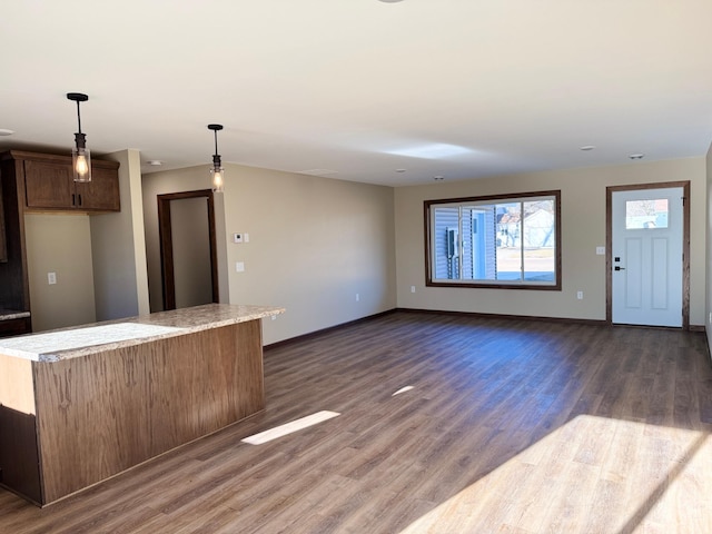 interior space featuring dark hardwood / wood-style floors and hanging light fixtures