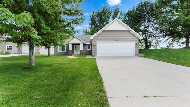 view of front of property with a garage and a front yard