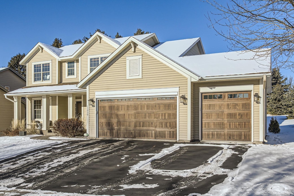 view of front of house featuring a garage and covered porch