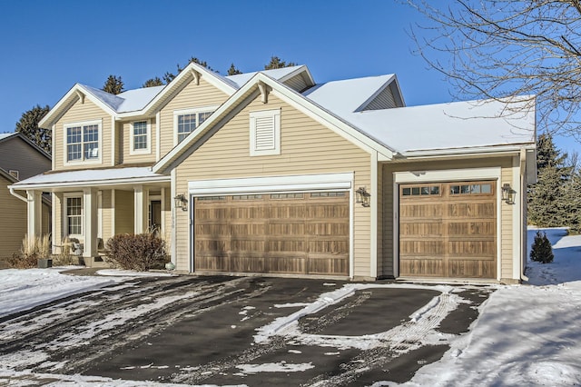 view of front of house featuring a garage and covered porch