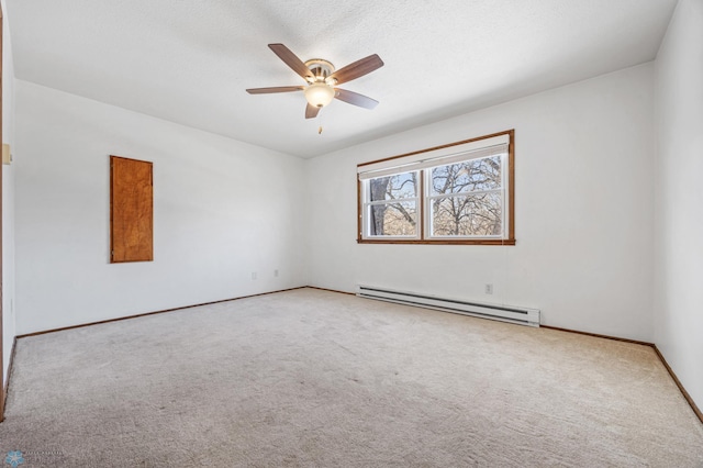 empty room featuring ceiling fan, light carpet, and a baseboard radiator