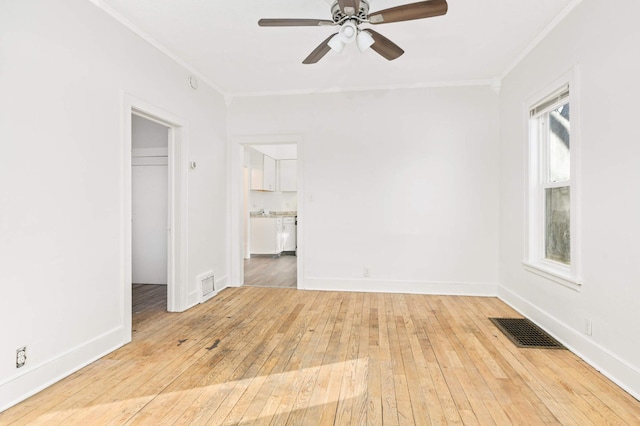 unfurnished bedroom with ceiling fan, a closet, wood-type flooring, and ornamental molding