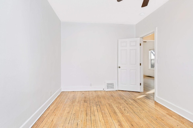 spare room featuring ceiling fan and light hardwood / wood-style flooring