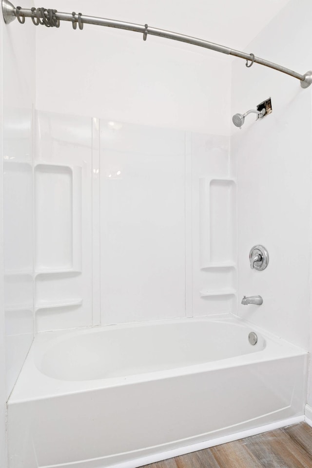 bathroom with  shower combination and hardwood / wood-style flooring