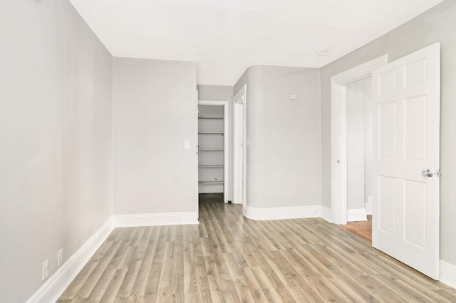 spare room featuring light hardwood / wood-style floors