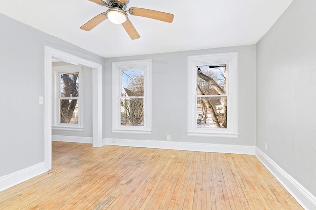 spare room featuring ceiling fan and light wood-type flooring