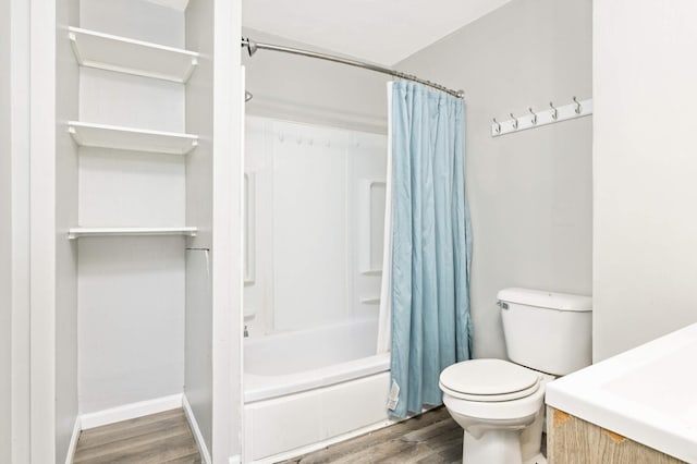 bathroom with shower / tub combo, hardwood / wood-style flooring, and toilet