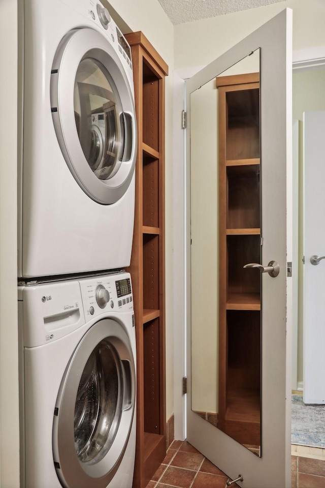 laundry room with stacked washing maching and dryer