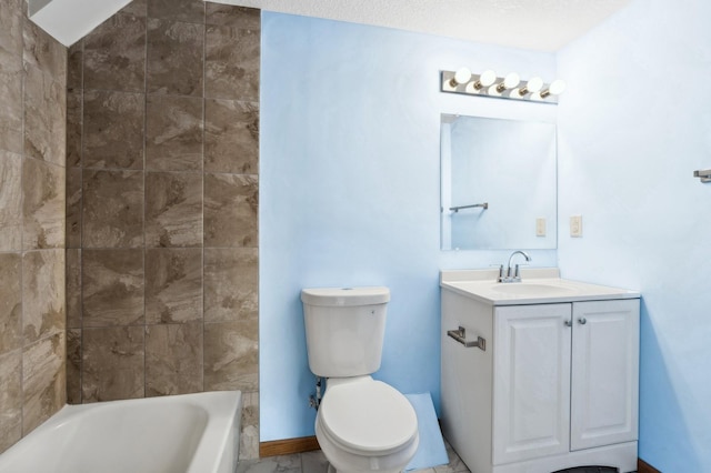 full bathroom featuring a textured ceiling, vanity, toilet, and tiled shower / bath combo