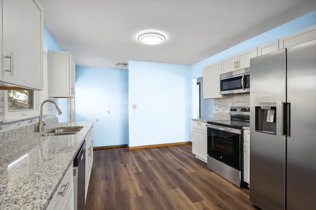 kitchen featuring white cabinetry, sink, and appliances with stainless steel finishes