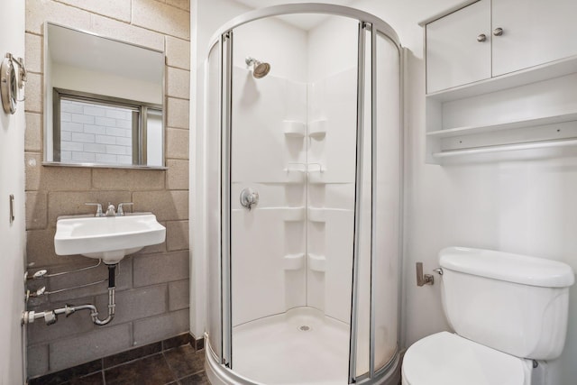 bathroom with backsplash, sink, toilet, and walk in shower