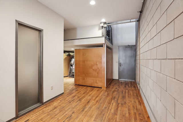 unfurnished bedroom featuring hardwood / wood-style floors