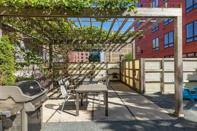 view of patio / terrace with a pergola and grilling area