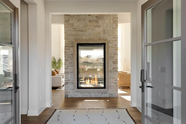 hall with dark hardwood / wood-style flooring