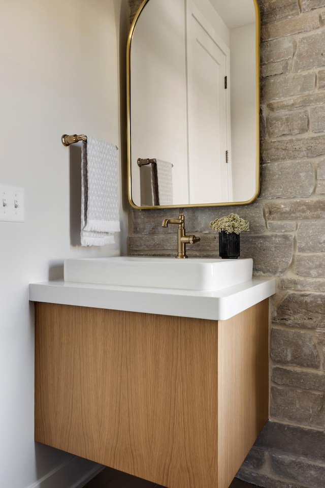 bathroom with decorative backsplash and vanity