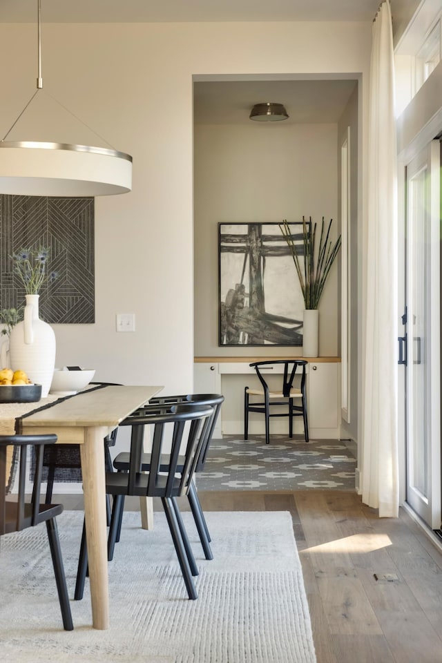 dining space featuring hardwood / wood-style floors