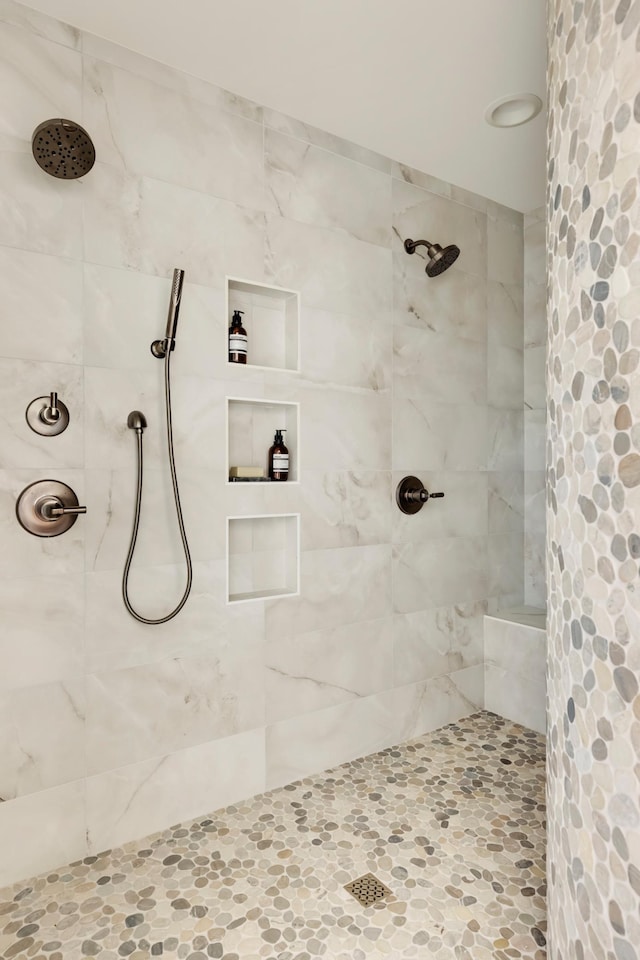 bathroom with tiled shower