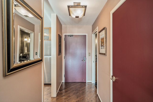 corridor featuring dark hardwood / wood-style flooring