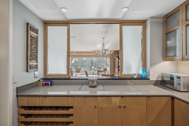 kitchen featuring a notable chandelier