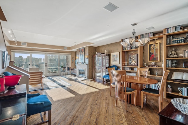 dining space featuring wood-type flooring