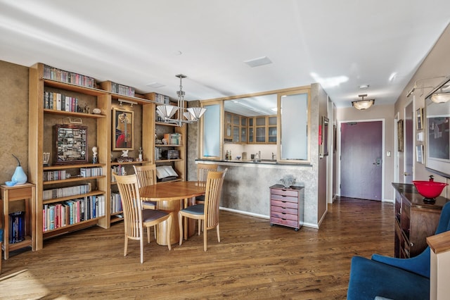 dining area featuring dark hardwood / wood-style floors