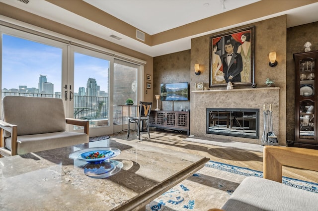 living room with a fireplace and french doors