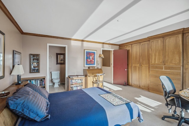 bedroom featuring light colored carpet, ornamental molding, and connected bathroom